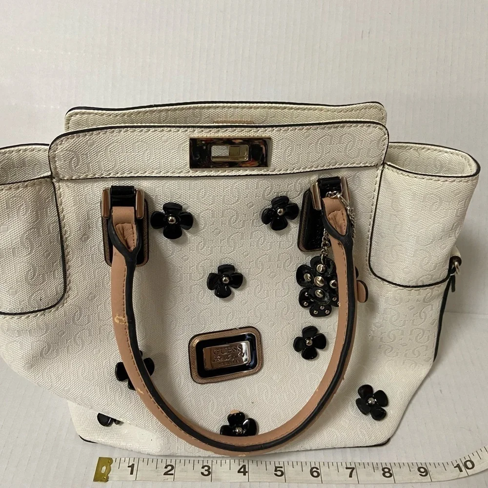 Guess purse cream w black flowers useful but well loved $49